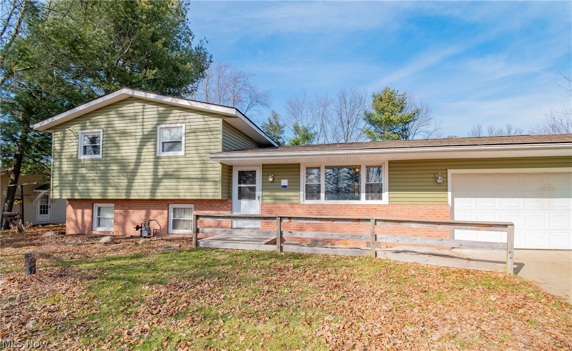 Welcome to 1195 Chaparrel Road! This 3 bedroom, 1 bathroom split level has so much character and loads of potential! Upon entry you will be welcomed by an open floor plan main level boasting custom tile flooring. The kitchen offers granite countertops, light wood cabinetry, and a gorgeous custom concrete sink. Large living space in the basement can be used as a family room or rec room. Upper level includes the 3 bedrooms and 1 full bath. Eat-in kitchen grants access to your spacious backyard. This includes a pool, swing set, covered bar with granite countertops, gardening bed, and a She Shed/Man Cave with electric and indoor/outdoor carpet. Conveniently located near Hartville Kitchen, Hartville Hardware, restaurants, and entertainment. Don't miss your opportunity! Schedule your private viewing today!