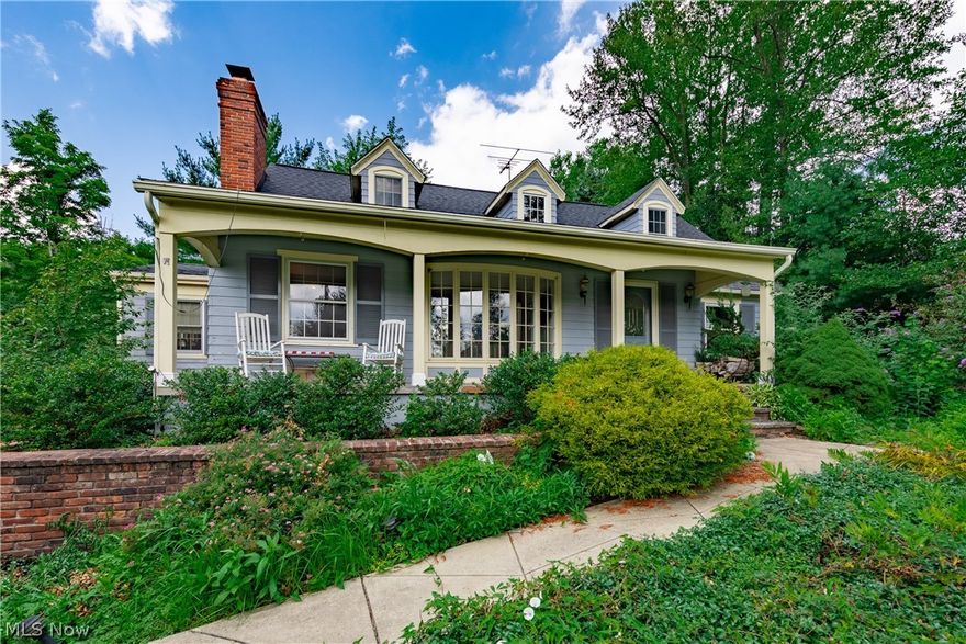 A Solon Treasure!  This 1940's colonial is one-of-a-kind, remodeled and expanded over the years by the owner/master-builder.  SEE INTERACTIVE TOUR. Improvements from the original foot print include: a family room that opens to the dine-in kitchen, master bedroom suite, enormous sun room with sauna, finished basement, first floor laundry, and tiered deck. Don't miss the fine woodwork in several of the first floor rooms: crown moldings, built-in cabinetry, wood paneled ceilings. Kitchen has double ovens and stainless refrigerator.  All bedrooms have ceiling fans and walk-in closets.  Many newer windows and hot water tank; a separate heating/cooling system for master and sunroom; sunroom floor is built to accommodate a hot tub - plumbing in crawl space beneath. Enormous barn/garage/workshop.   Bring your ideas for updates -  this one's a gem!