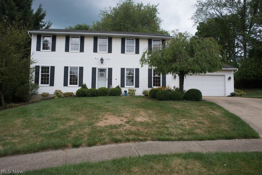 Located on a quiet Cul-de-sac sits this beautiful 2-Story home.  One owner and custom built by Emil Baxstrom.  This 4 bedroom home boasts over 4500 finished sq ft.  The main level features a large foyer that immediately welcomes you with hardwood flooring that extends into the large eat-in kitchen.  Off the kitchen is the family room with a built-in bookcase, wood-burning fireplace and doors to the 12x22 screened-in porch and patio with views of the large backyard that extends into the woods and is perfect for morning coffee or a relaxing afternoon.  On the opposite side of the kitchen is the spacious dining room for entertaining guests and holiday dinners.  An open doorway leads into the spacious living room.  A private den with wall-to-wall bookcase would also be a great office space.  Half bath and laundry off garage completes the main level.  The lovely stairway leads you upstairs that includes the owner's suite with 2 closets and private bath.  Three additional bedrooms share a fu