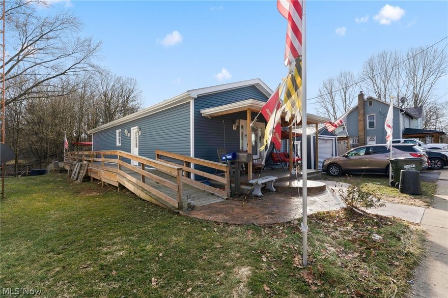 New Constructed Ranch home in East Palestine. This home was built in 2018-2019 using owners existing lot and keeping the existing basement. Home features a welcoming front porch with stamped concrete and new exterior siding. Large great room open concept to huge kitchen. Kitchen features an abundance of upgraded cabinetry with soft close drawers. Large Center Island with Granite Countertops. Stainless appliances. Throughout the first floor there is Luxury Vinyl wood look flooring. Need all one level. This home has a first floor Laundry Room. Both bedrooms are on the first floor with the master featuring an ensuite bath.
The lower basement surprises with a new addition of finished tiled Recreation Room. The lower rec room opens to a Walk Out Patio with more stamped concrete. The Master Bedroom opens to a large deck overlooking the fenced in backyard and providing shaded area for the patio below. There is also a ramp making this home Handicap Accessible. Everything new in 2019 when cons