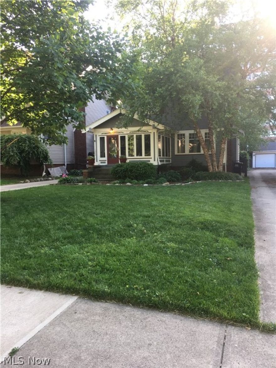 This gorgeous century home has been lovingly updated to modernize while preserving the charming details and quality expected in a Lakewood house. Located on one of the most desirable streets in Lakewood within walking distance of downtown, Lakewood Park and several schools. updated electric, freshly painted. updated kitchen recently renovated with brushed stainless appliances and top-of-the-line cabinetry. hand-made, polished concrete counter tops with inlaid glass details, glass tile back-splash, brushed stainless, under cabinet lighting. In the dining room, solid oak built-ins. Living room solid oak crown molding, including a solid oak pocket door. Living room includes a frequently-used, wood burning fireplace with brushed stainless blower insert. Finished, vaulted-ceiling third floor bedroom/playroom can also be used as a den or office.  2nd floor bonus enclosed porch (currently an office) can be converted to create larger bathroom suite. Beautiful glassed-in, three season front por