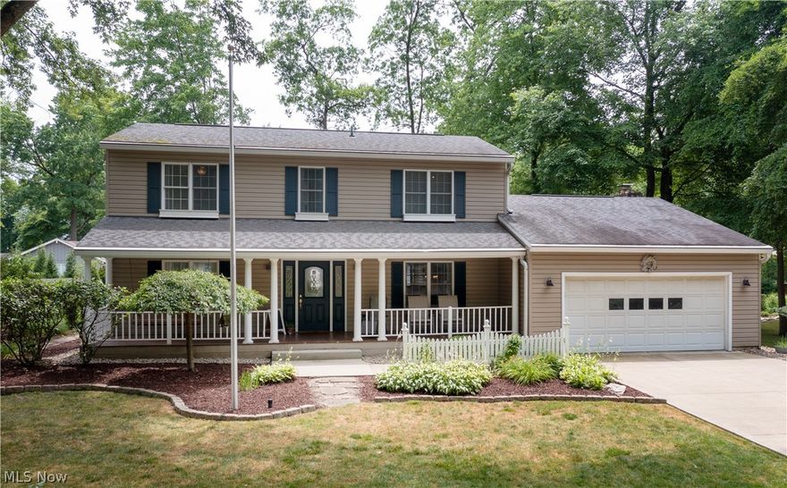 This beautiful home is located in the excellent-rated Jackson LSD. A covered front porch welcomes you to this spacious Colonial home with approximately 2,600 Sq Ft of living space. An inviting foyer leads to the family room (left) and the dining room (right). The family room features a library area with built-in shelves, storage, and a window seat. Beautifully decorated, the dining room has wainscoting and columns leading to the kitchen. The kitchen offers stainless steel appliances, a subway tile backsplash, an oversized sink, and granite countertops. The great room features a brick fireplace, wood ceiling beams, and access to the 2-car garage. Stepping down from the great room is a rec room with built-in shelves, a wet bar, and access to the screened-in patio (12x24), making it the perfect place for entertaining friends and family. Completing the main floor is an office with built-in shelving, two half baths, and a laundry room.  Four large bedrooms and two full baths, including the
