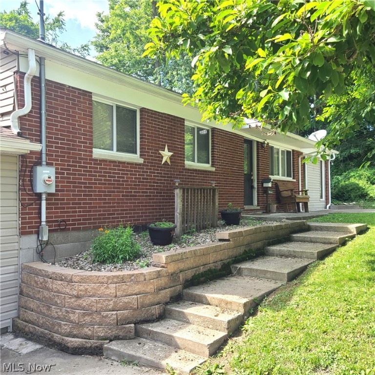 Very nice and clean ranch style home in Hillandale neighborhood. Open living/dining area with the kitchen just off of the dining room. Three bedrooms with hardwood floors and a full bath complete the main floor. The lower level is a large family room, a half bath and laundry/storage area. There is an above ground pool, deck and hot tub to enjoy this summer! Seller states siding and windows 2000, Water heater 2013, 200 amp electric panel and kitchen was remodeled in 2003.