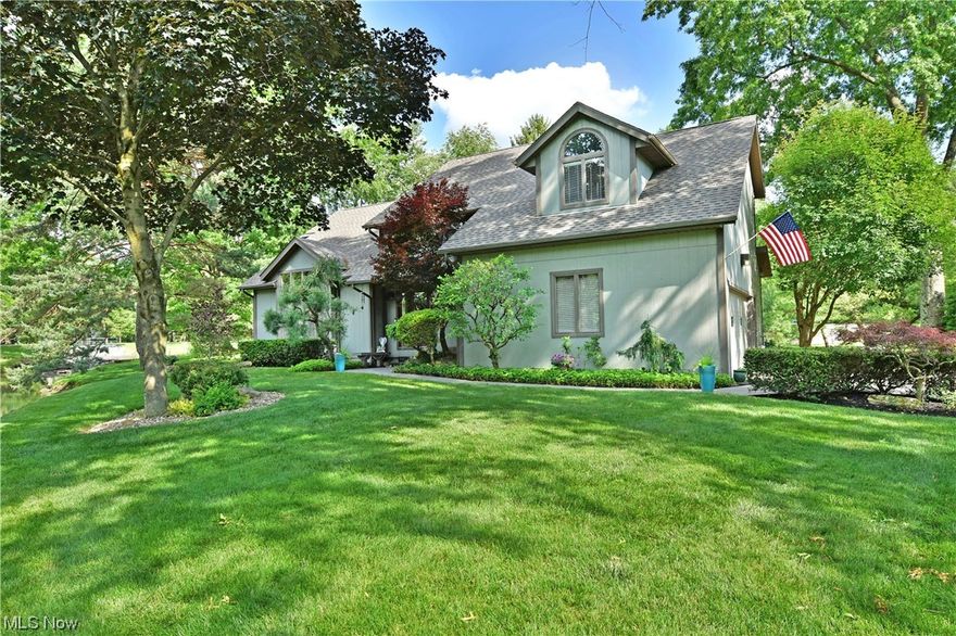 A masterclass in contemporary styling and craftsmanship, the crown jewel of Parkside Drive is offered for sale for the first time. The large pond and meticulous landscaping provide a stunning welcome as you make your way to the home. Inside, a soaring two story foyer gives way to an oversized formal living room with cathedral ceilings, updated carpeting and access to the wrap around deck. A large dining room with beautiful updated lighting is steps away. The beautifully remodeled kitchen (2019) is sure to impress! Soft-close cabinetry, under cabinet lighting, quartz countertops, on demand hot water and upgraded stainless steel appliances sing in perfect harmony with gorgeous lighting and tiled floors and blends seamlessly with the eat-in dining area as well as the sunroom filled with natural light and access to the outdoors. The family room showcases newer carpeting (2021), gas fireplace with alcove lighting, and bar area. A home office and updated powder room round out the first floor