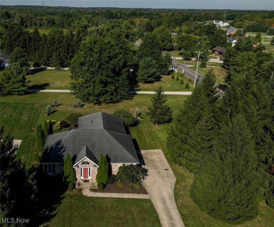 Wonderfully appointed brick ranch includes beautiful hardwood floors, vaulted ceilings, gas start fireplace, a step saving kitchen hosting beautiful granite countertops, a large center island, generous cabinetry, formal dining stepping off through French doors to an inlaid paver patio with a separate firepit with plenty of privacy offered from the mature landscaping including a towering pine grove.  The 3-car garage is complete with a removable accessibility and workshop area.  Peaceful rural cul-de-sac while conveniently located minutes from major interstates, shopping, restaurants and schools.