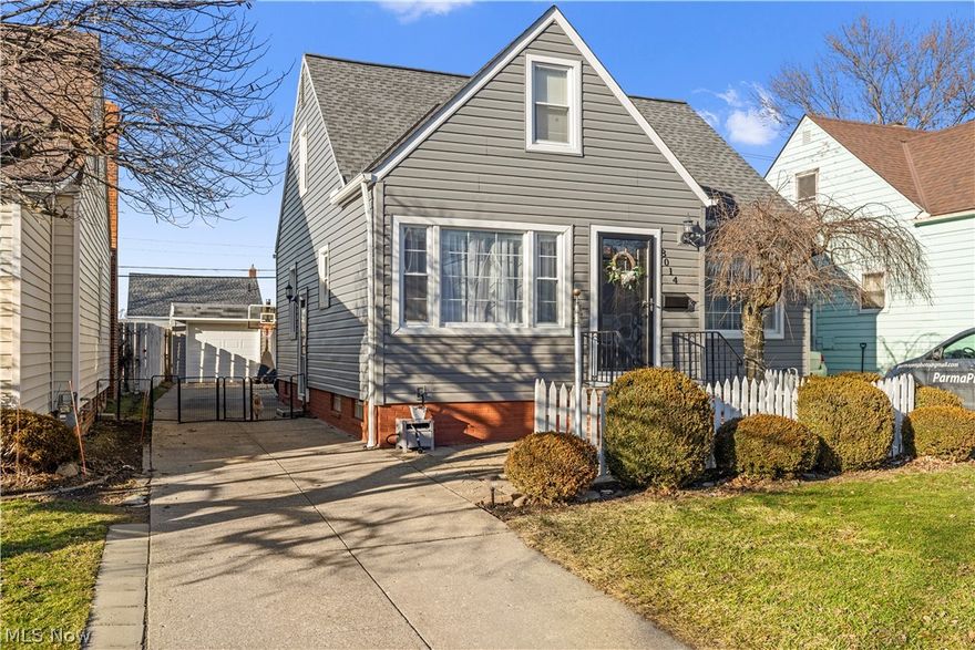 Welcome to this well-maintained Cape Cod offering 4 bedrooms, 2 full baths, a finished lower level, and a 2-car garage. This move-in ready home features great curb appeal with a classic white picket fence, updated siding and gutters (2024), and front steps replaced in 2021. Inside, you’ll find an updated kitchen (2018), new first-floor flooring (2024), and a functional layout with plenty of living space. The second floor includes two bedrooms, hardwood flooring, a loft-style hallway, and a spacious walk-in closet. The finished lower level adds a large rec room, bonus room ideal for an office or playroom, workshop area, laundry, and full bath setup, with new flooring completed in 2022. Additional updates include the roof (2016), hot water tank (2018), insulation (2020), and a backyard gazebo added in 2022. Convenient Parma Circle location close to highways, shopping, and more.