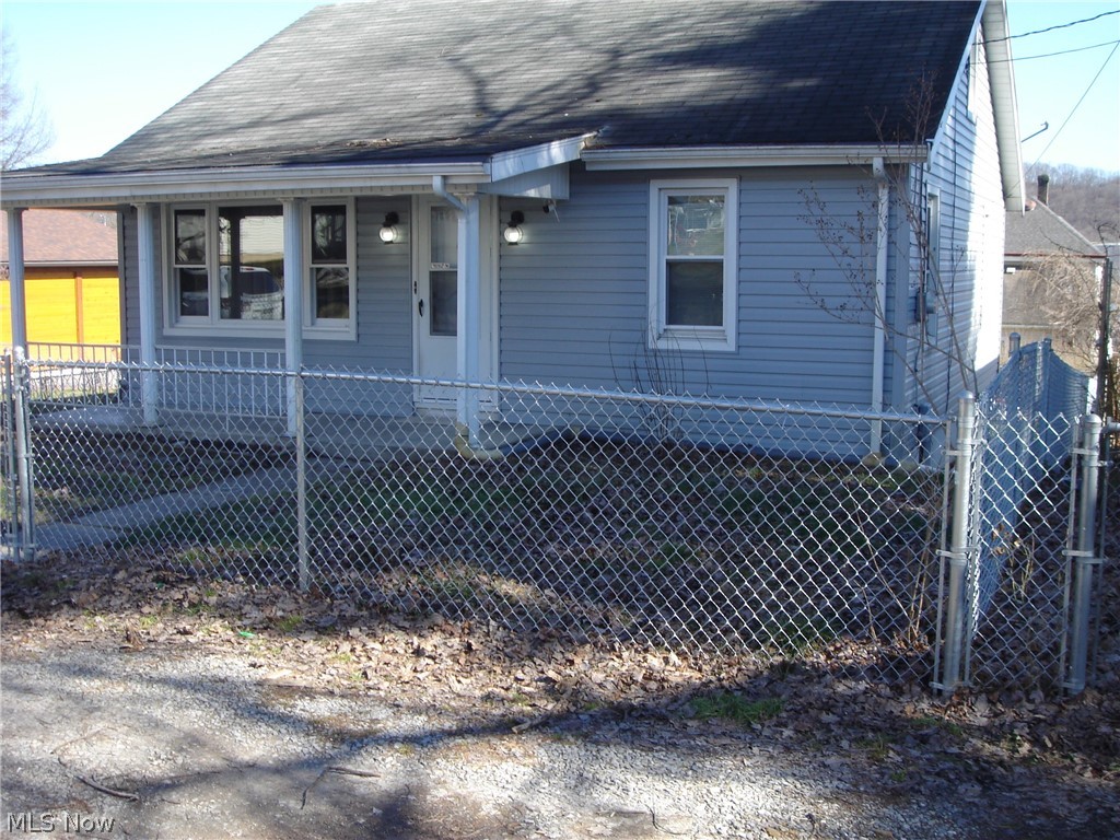 This completely made over house is just waiting for you to call home. Outside the double lot is completely fenced in with a gate in the back of the house for easy access to the garage. If you enjoy the outside air, then you will be extremely satisfied with the large 16x16 covered deck overlooking the coy pond. The inside will not disappoint you, freshly painted, new carpeting, laminate floor in the kitchen. In the two bedrooms downstairs the oak flooring has been restored to it's beauty. If you're worried about needing appliances for your new home, then worry no more, the kitchen comes equipped with new stove, refrigerator and microwave. The kitchen also features new cabinets and counter tops. Only thing missing is your call to view this house waiting for you to call it home. Call now for your private tour.
