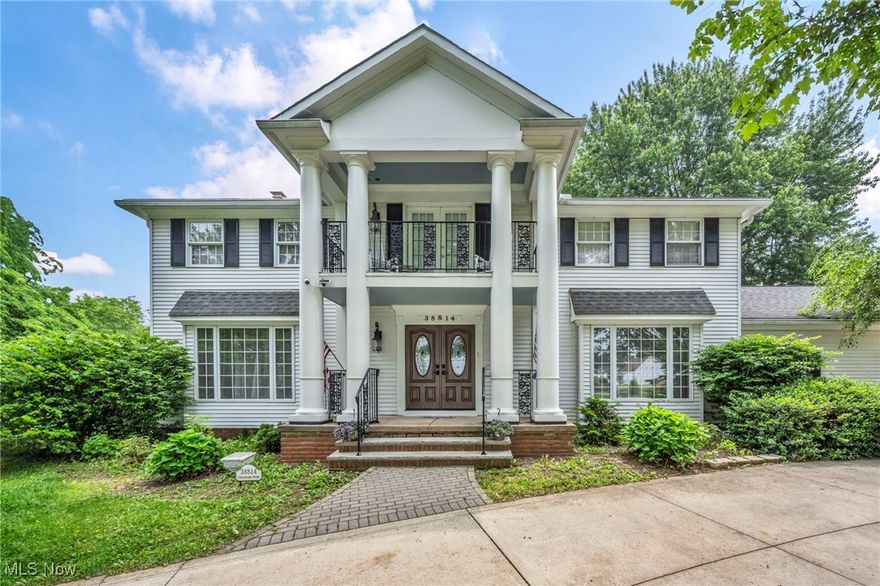 This well-maintained Colonial presents a blend of thoughtful design and timeless charm, offering four bedrooms, three full bathrooms, and two half bathrooms across a spacious, traditional layout.

The main level features a classic front entryway that flows into both formal and relaxed living spaces. The family room, with its gas fireplace, provides access to a freshly painted deck, a space suitable for outdoor enjoyment or everyday moments.

The kitchen includes generous cabinetry, solid-surface countertops, stainless steel appliances (including a new stove), and an eat-in bay window area that offers natural views of the fenced yard, ideal for casual dining or quiet mornings.

Four separate staircases connect the upper and lower levels of the home, including a stair lift on the rear staircase for added accessibility.

Upstairs, the primary suite includes double closets, a full en-suite bath, and a private second-story balcony to enjoy a cup of coffee. Three additional bedrooms offer closet storage and have access to the two full bathrooms on this level. A hallway air filter was recently replaced.

The finished walk-out basement includes a second gas fireplace, a recreation area, a half bath, laundry space, and walk-out access to a private lower-level patio. A bonus room on this level provides flexible use. A large area rug in the basement will remain with the home.

Additional features include a heated attached garage (2+ car), a circular driveway, central air, a 2021 hot water tank, and a security system that may transfer to the next owner. Located within minutes from Downtown Willoughby, as well as parks, schools, and local services. You won't want to miss this one, grab your favorite real estate agent and schedule a showing Today!