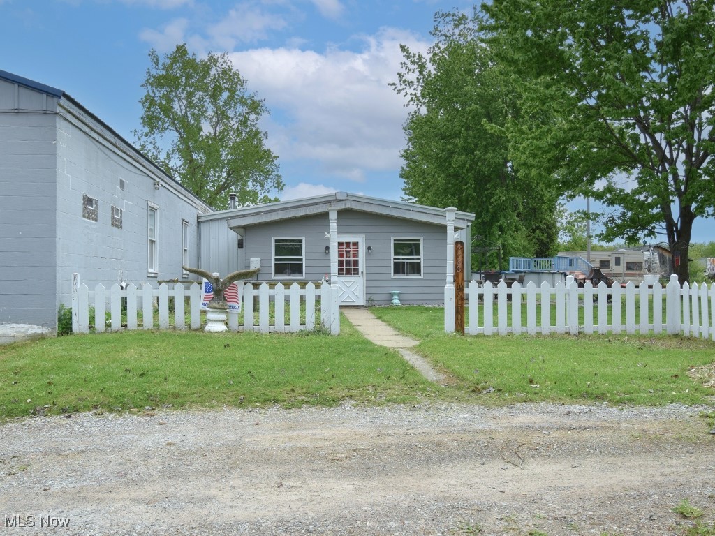 Spacious 2,700SqFt two-bedroom apartment with approximately 4,800SqFt warehouse! Recent updates are newer metal roof along with Newer septic system installed. Tons of potential with this property. This offering includes two parcels—4486 S. Ridge Rd. and 4460 Elberta Rd.—totaling approximately 2.77 acres of prime real estate. Ideal for owner-operators, investors, or redevelopment, this property offers flexibility, space, and location all in one package.