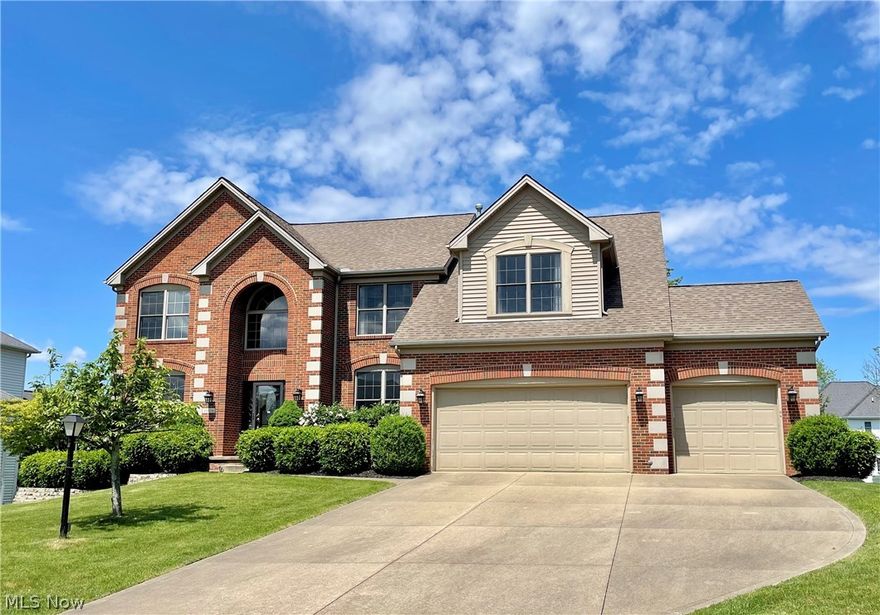 Spectacular custom built brick and stucco home located in sought after Waterford Crossing with 3 car garage!  Dramatic vaulted foyer opens to modern floorpan with 2-story great room.  All new engineered hardwood flooring, staircase has modern wrought iron balustrade that extends to 2nd floor.  Lovely white shaker cabinetry with island, quartz countertops and all new stainless appliances.  Convenient 1st floor laundry with service sink.  A 5th bedroom on main floor next to a 4th full bath for guests.  Upstairs is a luxurious owners suite with upgraded bath fixtures and feature wall of shiplap.  The entire lower level has been finished with a wet bar that features a cut stone surround, next to a theatre room and full bath room.  Ceiling heights are 9ft.  (The attic is also finished with access from the 2nd floor hallway).  The deck is made of composite material and has stairs leading to the paver patio.  Truly this is a fantastic opportunity in Strongsville!