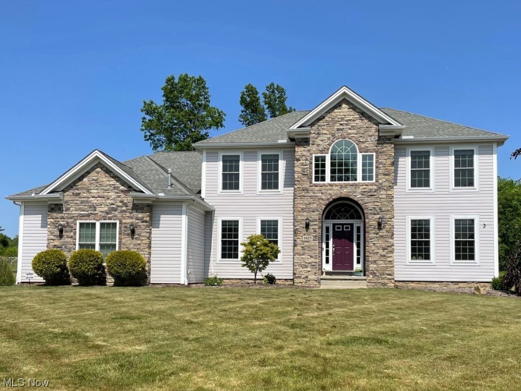 Located on a quiet cul-de-sac in the desirable Wooded View Estates, this stunning 5-bedroom, 4 full bath colonial boasts an inviting open floor plan. Entering through the 2-story foyer, you are greeted by soaring ceilings, decorative moldings/trim, a bold staircase, & an abundance of natural light. The spacious living room features an impressive 2-story fireplace, cathedral ceiling, and large striking windows. The gourmet eat-in kitchen incorporates granite countertops, cherry cabinetry, stainless steel appliances, a center island, generous counterspace, & a pantry. Rounding off the main floor, you will find a bright airy office, bedroom, full bath, formal dining, and mudroom. Upstairs, you are graced with an amazing scenic view of your wooded oasis! The sizable primary suite w/ vaulted ceiling offers 2 walk-in closets & a luxurious ensuite w/ 2 separate sink areas, new garden tub, tile shower, & toilet closet. Three additional roomy bedrooms are situated on the 2nd floor along w/ a convenient 2nd floor laundry room! The finished lower level of this home offers a family room, rec area w/ Nature Stone, flex space room, full bath, & a sizable storage area. Additional benefits include: heated 3+car garage w/ Nature Stone, whole house generator, Invisible Fence for pets, whole house dehumidifier, 1+ acre lot, many updates, & a Pool Table. Situated near the Cuyahoga Valley National Park, Walking Trails, Boston Mills Ski Resort, and 3 Major Highways. Call today!