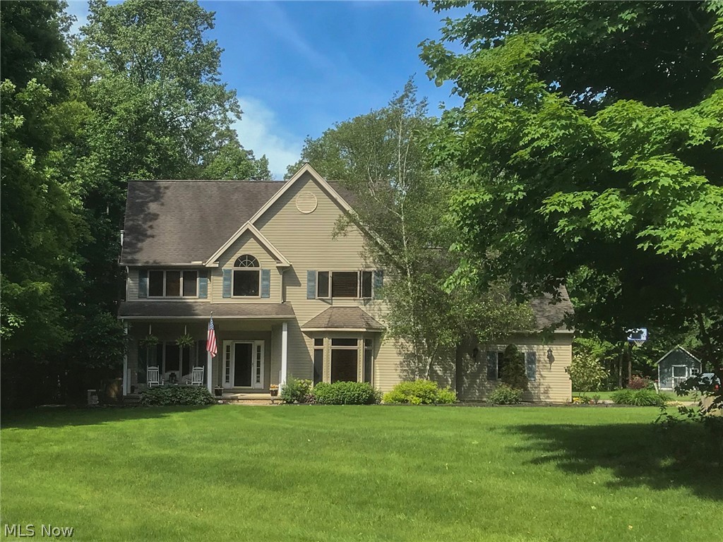 This beautiful home is located in picturesque Newbury Township, on a 2-acre lot adjacent to 30 acres of land conservancy. Step inside, noticing the two-story foyer, ceramic tile, & formal living room with crown molding and wainscoting. Another large formal living space leads you into the formal dining room with lots of natural light. The updated kitchen offers a large island with extra seating, stainless steel appliances, granite counters, & double sinks. The kitchen also overlooks the two-story great room with wood-burning fireplace, floor to ceiling windows, & French doors with access to the back deck. A mudroom & laundry room complete the 1st level. Upstairs, a spacious loft overlooks the great room, perfect for office space or a reading nook. The master suite offers a vaulted ceiling, a large walk-in closet, & luxurious ensuite with double vanity, soaker tub, and glass-enclosed shower. Two additional bedrooms share an updated full bath, & a bonus room with built-ins could become an