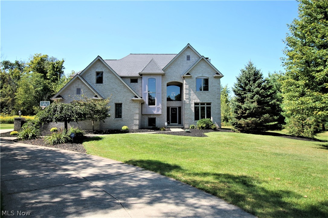 Precious memories begin right here! Welcome to this charming four bedroom, three full & one half bath home with geothermal heat. Sensational open flow to the great room which has an abundance of wall to ceiling windows to let the natural light shine through, & has wood floors through out the first floor. The great room also offers a vaulted ceiling & stone wood burning fireplace. The dining room has tray ceiling. The chef's kitchen has an abundance of gorgeous cabinets, stainless steel appliances, built in oven & microwave, counter top range with exhaust & recessed lights. There is a huge island, new granite 2019 & an eat in area that has windows to the picturesque backyard. The fabulous full bathroom has tile shower with pedestal sink & laundry room that completes the first floor. The staircase going upstairs is extra wide & goes to the large bedrooms and full bath. The master suite offers a walk in closet & a fully remodeled bathroom with 5x5 tiled double shower. The lower level is