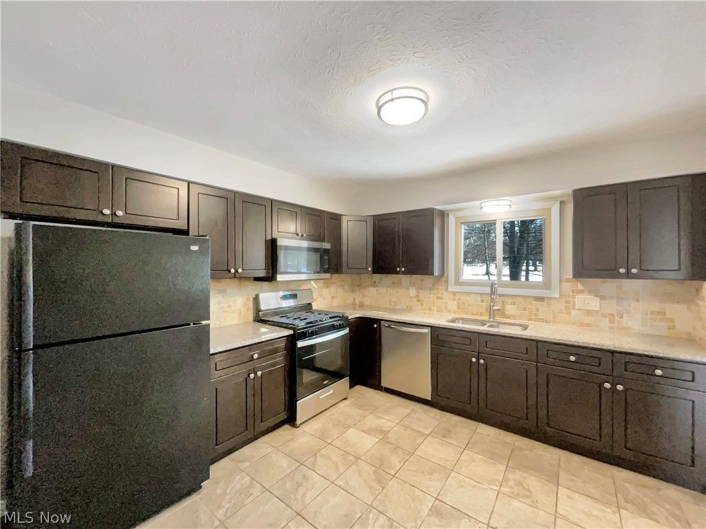 Photo of 11001 Shaker Drive, North Royalton, OH 44133 (MLS # 5186717)