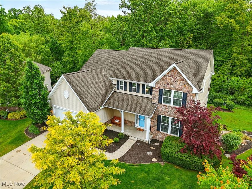 Nestled on a secluded lot in the picturesque Nature’s Preserve neighborhood, this stunning colonial home offers the perfect blend of modern comfort and natural serenity. Tucked away on a tranquil cul-de-sac, backing to preserved green space and Tinker’s Creek, this is a nature lover’s dream.  Step inside to discover gleaming new flooring that flows throughout the home. The heart of this residence is its beautifully appointed kitchen, boasting abundant cabinetry, sleek granite countertops, and high-end appliances. The open-concept design seamlessly connects the kitchen to a spacious living area and a cozy dining nook with direct access to the outdoors, perfect for entertaining or quiet mornings.  The first floor also features a formal dining room, an additional living space, a convenient half bath, and a well-equipped laundry room. Upstairs, the expansive owner’s suite is a true retreat, complete with a newly updated ensuite bath and dual walk-in closets. Three additional bedrooms with fresh flooring and a full bath provide ample space for family or guests.  The lower level is a standout, offering a walk-out to a private stamped concrete patio and endless potential for additional living space. Outside, the serene backyard is a haven, featuring a composite deck and stamped patio, ideal for soaking in the peaceful views of nature.  Don’t miss your chance to own this exceptional home. Call today to schedule a tour and make 3425 Eryn Place yours!