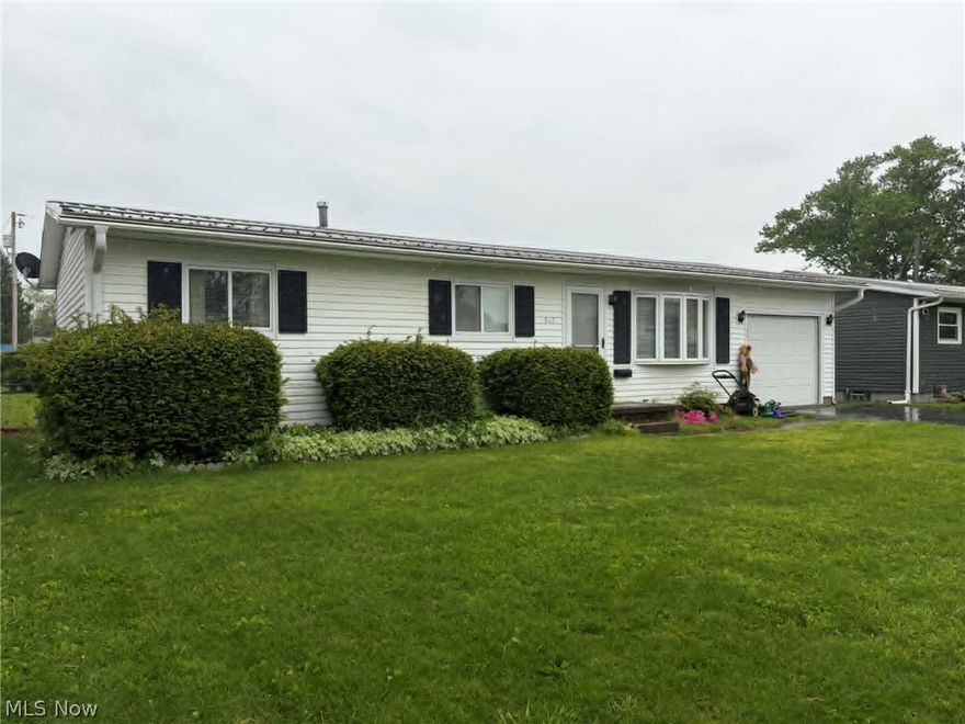This charming ranch-style home offers nearly 1,000 square feet of comfortable living space, conveniently located in town. Featuring 3 bedrooms and 1 full bath, and full basement.  The kitchen includes newer oak cabinetry, offering both beauty and ample storage, a custom bread box and small writing desk.  GAS stove, dishwasher, and newer french door refrigerator/freezer. Spacious living room is filled with natural light. One of the bedrooms features a compact washer and dryer hookup tucked in the closet. Full bathroom includes a newer walk-in shower for added comfort and accessibility. Step outside to enjoy a large level lot, fully fenced backyard off of the covered back patio.  Perfect for pets, play, or outdoor entertaining. A one-car attached garage adds everyday convenience. This home does need TLC, making it a great opportunity for buyers looking to add their own preference with painting, floors, and spring cleaning.