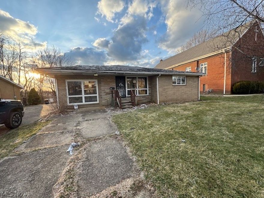 This spacious brick ranch offers over 1,800 square feet of living space with a distinctive design and plenty of character. The home features 3 bedrooms, 2 full baths, two living areas, an oversized basement, an enclosed porch, and a 2-car attached garage with a paved driveway. The backyard includes an additional detached 2-car garage topped by a 672-square-foot apartment, providing excellent potential