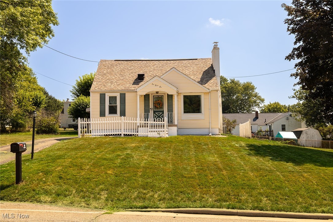 Don't miss out on this darling bungalow bungalow tastefully updated and conveniently located within the Louisville city limits and Louisville school district. Updates include new windows in 2021, a new roof 2023, a new water softener in 2021, and new kitchen appliances in 2021. Laminate floors in the kitchen, morning room and dining room, adding a modern touch to the spaces. A stylish barn door separates the living room from the bonus room, which can be used as a TV room, nursery, office, or even an extra bedroom. The bathroom has also been tastefully updated and is equipped with a heat lamp to keep you cozy after a shower. The first floor also features a living room complete with a fireplace and a bedroom with double closets. On the second floor you will find two additional bedrooms and a charming loft area. The lower level has a family or office, laundry area and a shower-toilet area. In addition to a one-car garage equipped with electricity and a garage door opener there is a carport for additional parking. An extra lot to the side of the home provides ample space for outdoor entertaining, cookouts, gardening, and other activities. This lot is partially fenced for added privacy. With easy access to highways, restaurants, and shopping, the location of this home is unbeatable. Public water and sewer services are also provided. This bungalow is a perfect blend of comfort and convenience.
