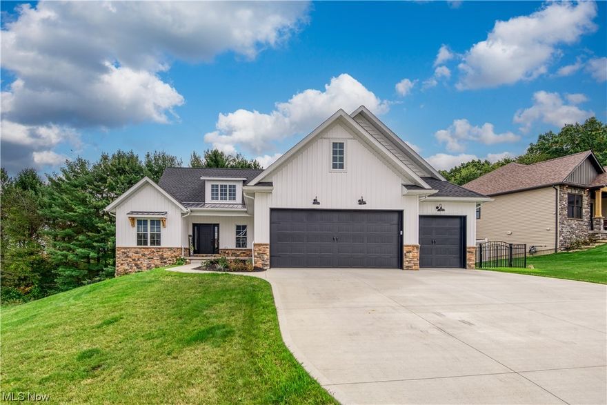 Step into the serenity of this exquisite modern farmhouse style ranch home, nestled within the idyllic Woods at Silver Creek. This thoughtfully designed 3-bedroom, 2-bathroom, 3 car garage haven beckons you with its blend of sophistication and comfort.   As you enter, you're greeted by an open floor plan that effortlessly combines the kitchen and living room, both adorned with a soaring vaulted ceiling. The heart of this home, the eat-in kitchen, boasts stunning quartz countertops that elegantly frame a generously sized island, offering seating for four. Your culinary adventures are made convenient with a spacious walk-in pantry.  The living room, adjacent to the kitchen, is a cozy retreat adorned with a fireplace featuring a striking floor-to-ceiling stone surround.  The thoughtful layout extends to the owner's suite, encompasses a tastefully designed bathroom, the walk-in closet opens the 1st floor laundry