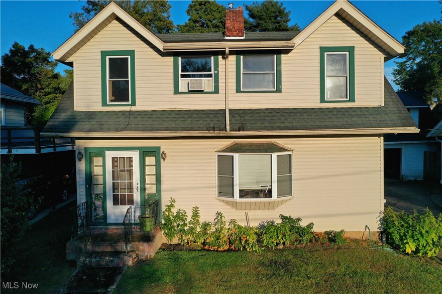 This charming Cape Cod home offers timeless details and a functional first-floor layout. Hardwood floors flow through the living and dining areas, with a bay window and fireplace anchoring the living room. Built-in bookcases in the dining room add character and storage. The kitchen completes the main level and features brand-new vinyl flooring installed in December 2025. The second floor includes three bedrooms and a spacious full bathroom, all with hardwood flooring and plenty of natural light. The full un-finished basement allows for additional storage space. Outside, enjoy a backyard with a firepit area and garden space. You'll also find an outbuilding perfect for all your outdoor tools. Above the shared garage features a private workshop area. The property backs up to a quiet cemetery, offering a peaceful and private setting. With its rich wood details, built-in features, multiple storage options, and serene surroundings, this home is a wonderful opportunity for those seeking charm, functionality, and small-town living in Millersburg. Selling AS-IS