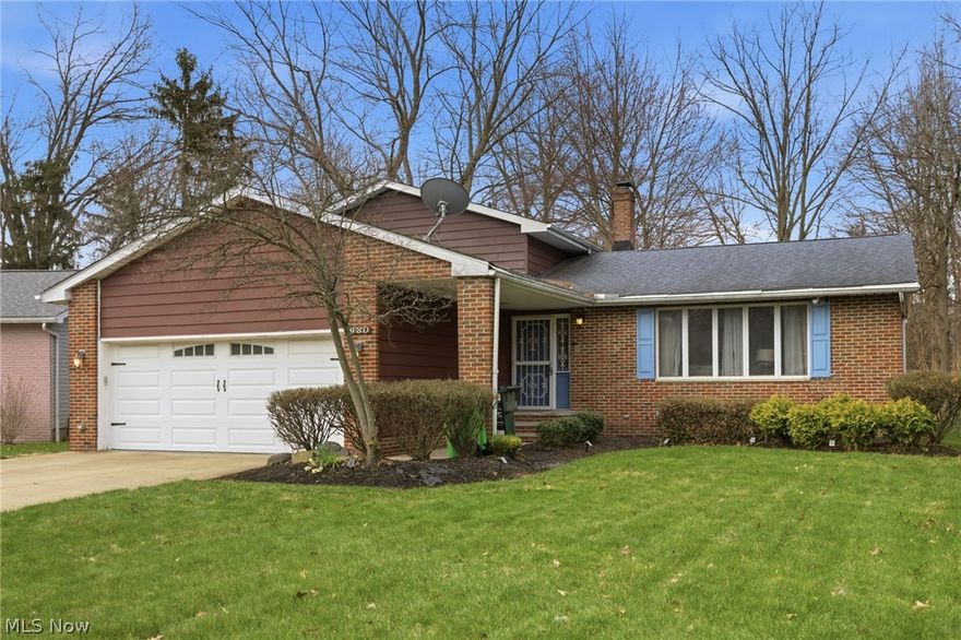 Welcome to 980 Carlone Place! This beautifully well maintained & spacious South Euclid split-level offers over 3,000 sq ft of living space designed to fit your family & lifestyle! The main living area boasts a spacious living room with natural light & flows directly into an inviting dining area. The updated kitchen offers new floors, freshly painted, updated countertops, new appliances including stove, refrigerator, dishwasher & garbage disposal. In addition, the main level offers updated entry way flooring, freshly painted & updated full bath. A lower-level family room with a gas fireplace adds additional living space for family or entertaining in addition to a small adjacent bonus room or office. The family room sliding glass doors leads to a beautiful rear outdoor green space with a concrete patio. The second level offers (3) nice sized bedrooms including the owner's suite with a private updated full bath, ceiling fans in each bedroom, ample closet space (1) additional updated full bathroom in the second-floor hallway. The partially finished basement with dedicated recreation area creates a flexible bonus space, separate laundry with washer, dryer included & plenty of storage space. The oversized attached 2 car garage features hot & cold-water supply & gas-powered heater. Additional highlights include 2021 hot water tank, roof approximately 12 years old, central air, central home vacuum system & 1 year Old Republic Home warranty included! This home checks all the boxes, don't miss the opportunity to make it yours! Schedule your private tour & make an offer today!