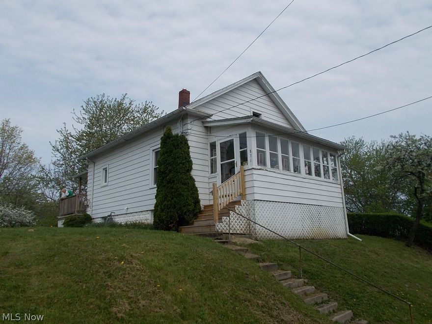 Very neat and updated home, located on a hillside, with partial view of the marina. New roof in 2014, newer furnace and air, updated electric  All windows have been replaced and the interior is all freshly painted. This home is a great buy.