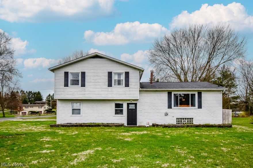 A fantastic home for entertainers! This 4-level split offers a unique layout perfect for hosting gatherings with friends and family. Dive into summer fun with a 20'x40' in-ground pool, complete with a diving board and convenient overhead door access to the detached three-car garage. Inside, the lower level sets the stage for indoor parties in the family room, while a spare bedroom with access to a full bath accommodates overnight guests. The main level boasts an open layout connecting the living room to the updated kitchen, featuring granite countertops, stainless steel appliances, a center island, and a dining area with French doors opening to a covered deck. Up a few steps you'll find three additional bedrooms, including the master with direct access to the modern full bath. With a full basement and ample closets throughout, there's plenty of room to store all of your personal belongings. Situated on nearly a half-acre lot in Lake Twp. and conveniently located between North Canton and Akron, commuting is a breeze. Don't miss the opportunity to create lasting memories this summer, call to schedule your showing today!
