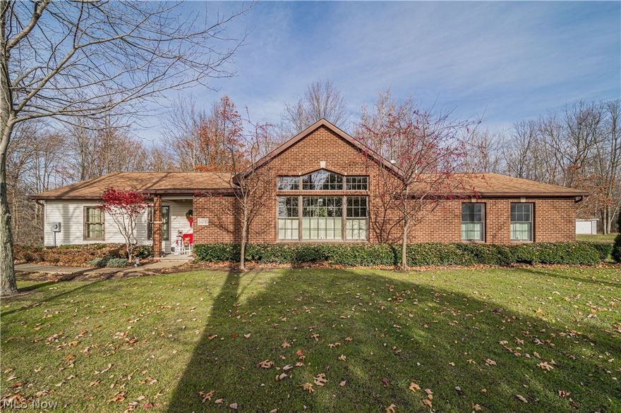 Amazing three bed, three bath RANCH home sitting on over an acre of land with an open floor plan on a quiet street. Cathedral maple ceilings and wall to wall windows providing natural light and views of nature.  Open living room with beautiful vaulted ceilings, and gas stone fireplace.  Heated floors are just another added luxury.  Kitchen offers Kraftmaid cabinetry, Stainless steel appliances, Sensor activated faucet, walk-in pantry and island with counter seating. Entertaining is a breeze- living room overlooks the dining room.  Master bedroom with plenty of closet space and a private bath with laundry.  The glorious sunroom offers cathedral maple ceilings, built-in cabinets with counterspace, window wall with a sliding glass door that leads to the patio with pavers.  The additional bedrooms all have large closets and plenty of storage.  Large oversized attached two car garage with two garage doors and an attic with pull down for easy access. The patio with pavers off the sun room is