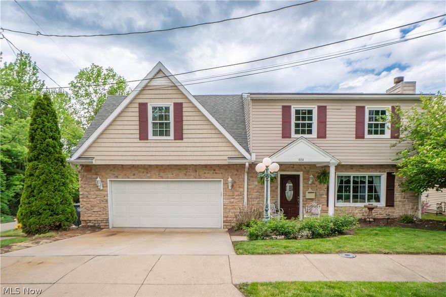 Beautifully cared for and full of charm, this 3-bedroom, 2.5-bath Colonial offers an inviting blend of comfort, style, and thoughtful outdoor living. Set on a corner lot with lovely curb appeal, a covered front porch, and an attached 2-car garage, this home welcomes you inside to a warm living room featuring hardwood-style flooring, a coat closet, and a cozy wood-burning fireplace. The space flows seamlessly into the eat-in kitchen, where rich cabinetry, beautiful hardware, granite countertops, a tile backsplash, stainless steel appliances, and an elegant dining light fixture create a kitchen that is both functional and impressive.

Just off the kitchen, enjoy easy access to the spacious back deck, complete with a covered gazebo featuring lights and fans—perfect for relaxing, entertaining, or enjoying quiet evenings outdoors. A convenient half bath completes the main level. Upstairs, the layout continues with a laundry closet, two generously sized bedrooms, a full bath with a beautifully tiled tub/shower surround. Added in 2009, the primary suite offers vaulted ceilings in the bedroom, abundant natural light, a walk-in closet, and a spa like private bath with a walk-in shower, soaking jetted tub, beautiful vanity, and tasteful finishes. The suite also includes a dedicated mechanical closet housing the furnace and tankless water heater, adding convenience and efficiency to this thoughtfully designed space.

The outdoor space is truly special, with mature landscaping that has earned Keep Akron Beautiful recognition for many years. The partially fenced backyard is thoughtfully arranged with a garden shed, seating area, round iron garden gazebo, and an additional detached 1-car garage with electric—offering a total of 3 garage spaces. A beautiful home inside and out!