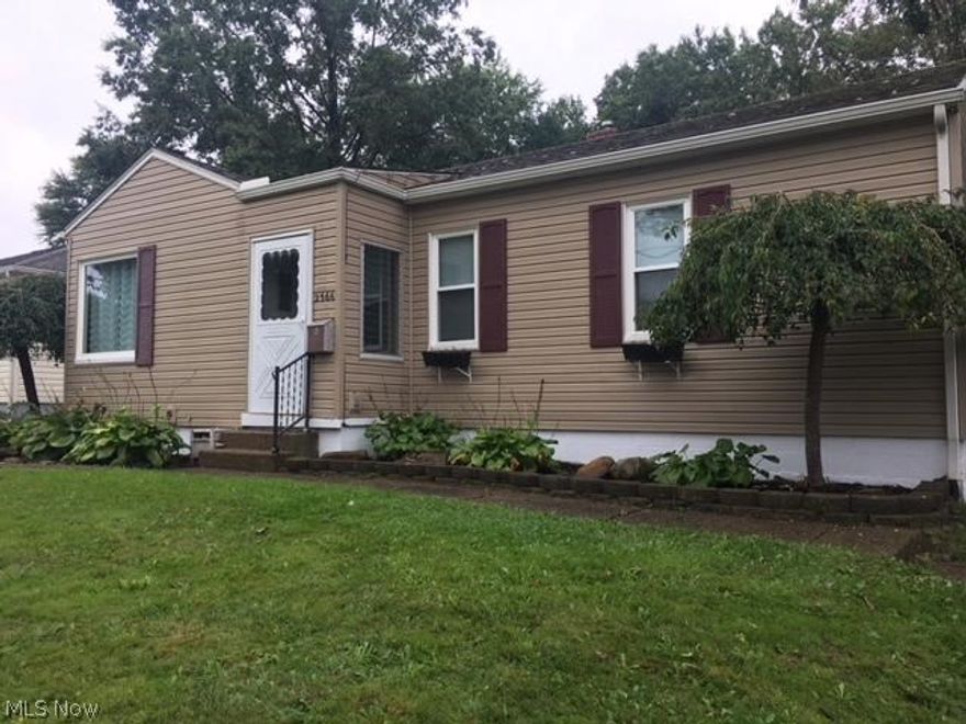 This Amazing ELLET AREA Ranch Style Home, with 3 bedrooms, 2 full baths and 1 half bath is MUCH Larger than it looks from the outside! Family room with wood burning fireplace and 1/2 bath addition, features slider to the patio and firepit in the fully fenced backyard. Possible in-law or guest suite downstairs, includes full bath, kitchenette area, bedroom and living room.  Additionally in the basement, there is still room for a separate rec room or storage and glass block windows. No more street parking with this 2 car detached garage and long paved driveway. The main bath has stylish bead board walls and pedestal sink. Original hardwoods are in the living room and bedrooms. You will find tons of cabinets and breakfast bar area in the fully applianced kitchen. New Windows 2016. New Hot Water Tank 2017. Home Warranty included. Close to schools, restaurants, shopping, highways AND the airport. What more could you ask for? Make this beautiful home yours today!