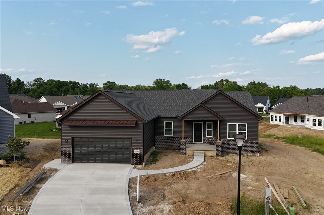 New Ranch Home, Just completed and ready for occupancy!
This modern ranch in a quiet Seville cul-de-sac features a popular open floor plan and eye-catching dark exterior with brick accents. A wide driveway and covered front entry add to the home's curb appeal.
Inside, the eat-in kitchen offers a large quartz island, ample cabinetry, and a spacious pantry, perfect for organized storage and everyday convenience. The owner's suite includes dual sinks, a walk-in shower, and a generously sized walk-in closet.
Enjoy relaxing or entertaining on the lighted, maintenance-free covered back deck. The 2-car garage is equipped with water and electric, and the full basement provides great potential for future living space.
Conveniently located near I-71 and I-76, this home offers quick access to all of Northeast Ohio. Under construction now?don?t miss the chance to make it yours!