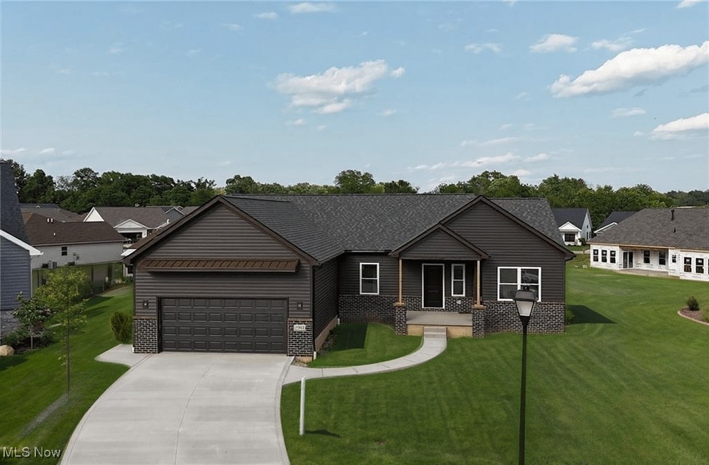 New Ranch Home, Just completed and ready for occupancy!
This modern ranch in a quiet Seville cul-de-sac features a popular open floor plan and eye-catching dark exterior with brick accents. A wide driveway and covered front entry add to the home's curb appeal.
Inside, the eat-in kitchen offers a large quartz island, ample cabinetry, and a spacious pantry, perfect for organized storage and everyday convenience. The owner's suite includes dual sinks, a walk-in shower, and a generously sized walk-in closet.
Enjoy relaxing or entertaining on the lighted, maintenance-free covered back deck. The 2-car garage is equipped with water and electric, and the full basement provides great potential for future living space.
Conveniently located near I-71 and I-76, this home offers quick access to all of Northeast Ohio. Under construction now?don?t miss the chance to make it yours!
