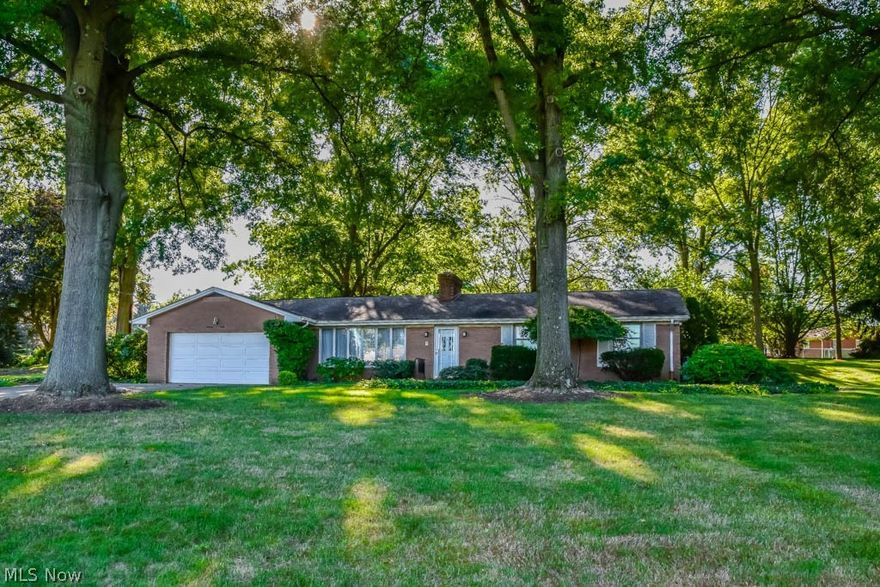 Lovingly maintained 3 bedroom all-brick ranch on a 1.22 acre corner lot in Jackson offering large living areas, a partially finished basement, a fantastic yard and a master suite! Crack open your cookbook in the applianced eat-in kitchen with beautiful granite countertops, tile flooring and a pantry! There's a dishwasher, countertop range, refrigerator and a double oven with a pull out range. Enjoy meals in the formal dining room that opens to the enormous living room with a wall of windows and a featured fireplace. Down the hall, the master suite offers crown molding, large windows and a private full bath with tile flooring and a walk-in shower. There are 2 additional bedrooms and a full bath with an extended vanity. Extra living space on the partially finished lower level with freshly painted floors! Two large rec rooms and a laundry room with a possible workshop space. Enjoy warm-weather days from the screened-in porch with a ceiling fan. Access to the 2-car attached garage with gla