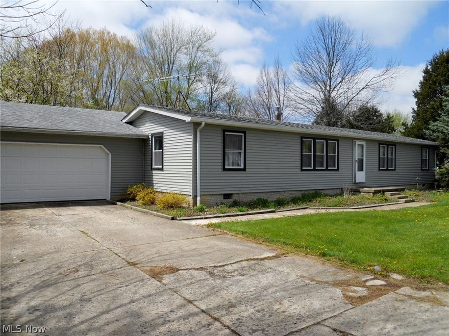 This is a must see! 1440 square foot ranch with large enclosed patio facing rear yard and deck. Newer roof, windows and siding on the exterior; AND newer flooring and updated kitchen and baths. You can entertain in either the large living room(ready for a wood burner) or the larger family room. Keep your prized vehicles protected in the attached two car garage. This home has a double lot equaling a little under half an acre. Don't miss this call today!