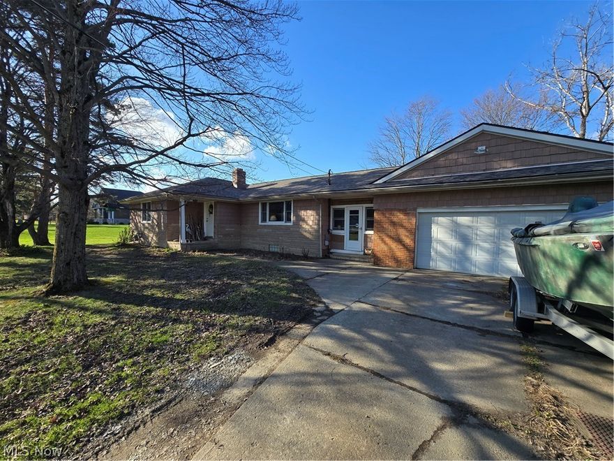 3 bedroom ranch with 2.75 acres of land in North Royalton.  This home has hardwood floors, updated bathroom, fireplace, large backyard, furnace with A/C replaced in 2018, hot water tank replaced in 2024, roof, shaker style vinyl siding and new windows in 2016.  There is a large stamped concrete patio in the backyard along with a shed.