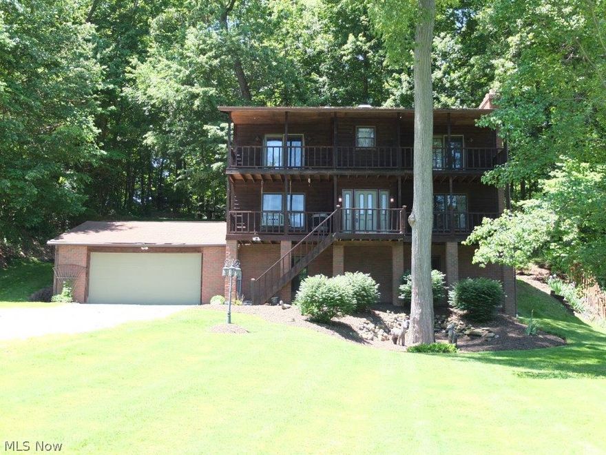 You will fall in love with this house! This 3 bedroom, 2.5 bath two-story sits on a very private wooded lot of almost an acre in Green. Absolutely stunning setting! This home has over 2,100 sq ft plus 408 sq ft in the finished walk out lower level. It has been meticulously maintained with the homeowner making constant upgrades. Last year all the flooring including tile and carpet were updated throughout the house. The master suite has two walk-in closets, a balcony off of the master and full private bath with ceramic tile floor. The other two bedrooms are very nice size with ample closet space. The main bath has a wonderful jetted tub. The first floor offers a nice laundry area, formal dining room and open concept kitchen and dinette and great room. Make sure to check out the large pantry!! The lower levels offers a recreation room, office space and ample storage. Oversized 2 car garage! Newer roof, pond in the front and newer appliances too! Come, see and be impressed!