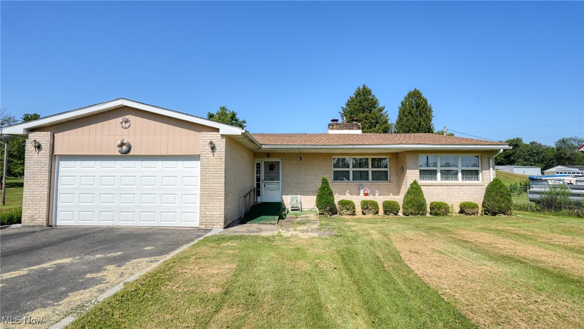 Escape the hustle and embrace peaceful country living with this spacious three bedroom home, perfect for families or anyone seeking easy one-floor living. Set on a generous lot, this property offers a large yard ideal for gardening, entertaining, or simply soaking in the open space and quiet surroundings. The home features a full unfinished basement with endless potential—ideal for storage, a workshop, or future additional living space. The functional layout includes an attached garage for added convenience and a bright sunroom that provides year-round enjoyment and a seamless connection to the outdoors. This property blends classic comfort with the charm of rural living — all while being just a short drive from town amenities. Call your favorite realtor today to schedule your showing!