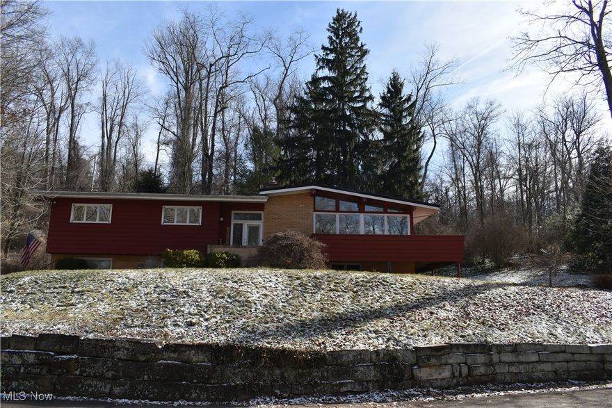 Checkout this charming 3/4 bedroom home on just over a quarter of an acre city lot, located in a low traffic area, close to the Coshocton School Campus.  The home features on the lower level a attached 27 x 25 heated 2 vehicle garage, a bathroom, a small room currently be used as a bedroom, a large family room with fireplace, and attached kitchen. The upper level features large foyer, living room with vaulted ceiling and fireplace.  Plenty of windows accentuate the living room and there is an outside wrap around deck on the front and side of the living room.  There is a dining area attached to the living room and a updated eat-kitchen. Off the back of the kitchen is a covered and enclosed porch and a deck that is off of the covered porch.  The home has lots of extra storage areas through out the home.  A new metal roof was put on in 2024 as well as a updated new electrical box.  There is a Generac generator that conveys with the home. Call today to schedule a private showing of this fine home.