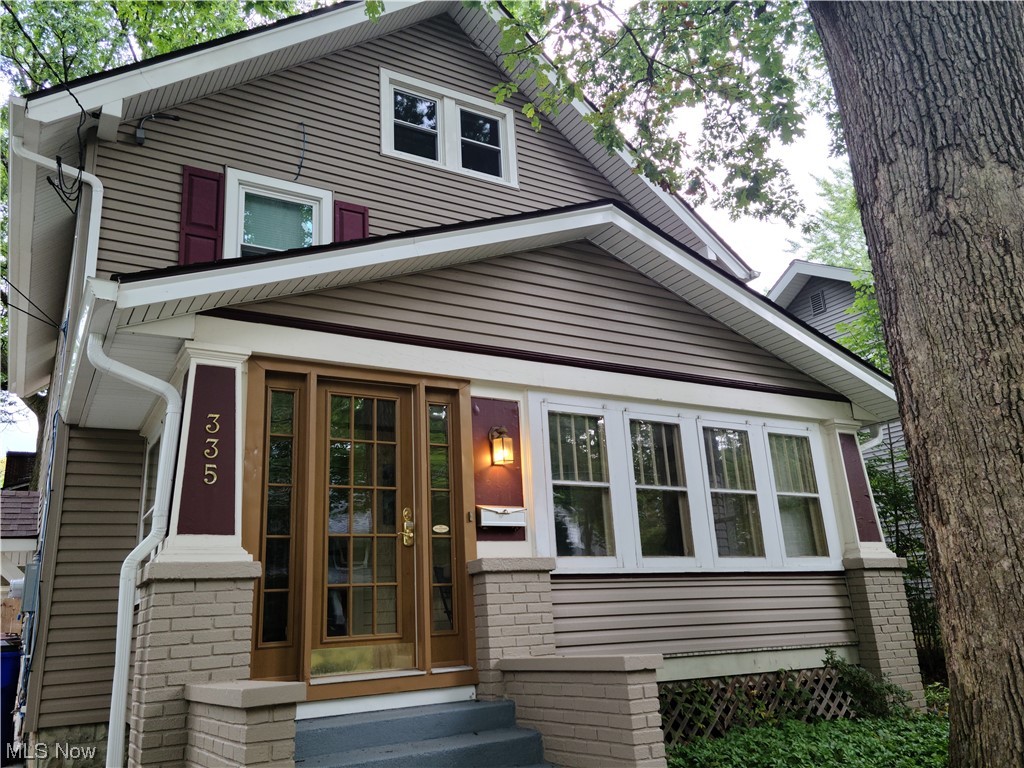 335 N Willow St Kent OH 44240 is a beautiful & charming home with natural woodwork showcased throughout on a tree lined street! Includes 3 or 4 bedrooms, 1.5 baths w/ half bathroom on the 1st floor for easy access to the mudroom from the fenced in rear yard for your family fun, especially with the 2 decks & concrete patio areas! Conveniently located just a couple of blocks to downtown Kent restaurants, shopping, trails, parks, river & only 2 blocks to Kent State University Campus! Great entertainment w/ live music venues, Kent State Athletics with hometown fields, Portage & Summit Counties Bike & Hike Trails, several micro breweries & many eateries from American, Mexican, Asian, Greek, Mediterranean & more! You can even skate downtown in the winter or at the ice rink year round, there is no end to what you can do! If you prefer to stay home, you can entertain since the Living Room w/ built-ins & hardwood floors opens to the Dining Room w/ wood window seat, a quaint enclosed front porch