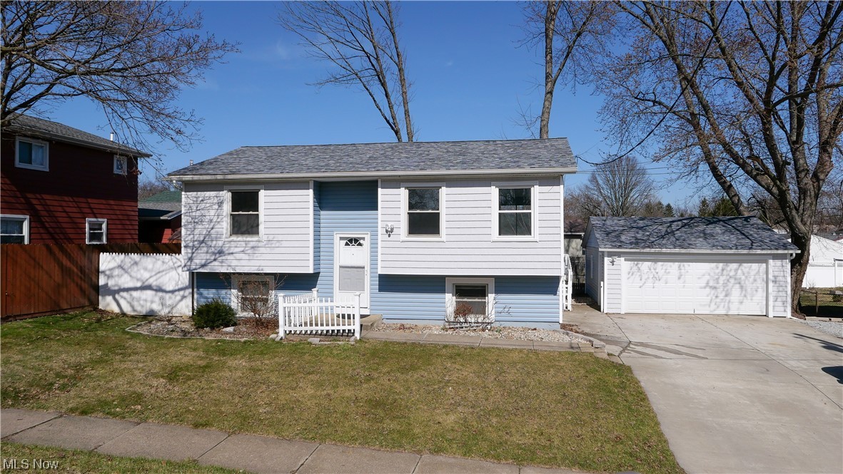 911 Independence Ave Akron, OH 44310 is a newly remodeled bi-level home with 3 bedrooms (prior owner utilized as 4 bedrooms) and 2 full bathrooms. The whole house has new carpet, paint, siding and baseboard heaters throughout. The dishwasher is new and the Roof is only 5 years old. This home is perfect for most anyone that likes their privacy or entertain with the layout and yard & big driveway. With bedrooms and full baths on both levels, this home is great for privacy! The lower level has a master bed and full bathroom, an Office that was utilized as a 4th bedroom previously, wonderful family room and laundry room. The main level has 2 additional bedrooms, full bathroom, Kitchen, dining room and large living room which is unique with full wall for privacy and easy furniture placement. The backyard is large and fenced with a nice big deck for grilling, entertaining or watching others play. There is a wide driveway with a large 2-car detached garage that has plenty of room for tools an