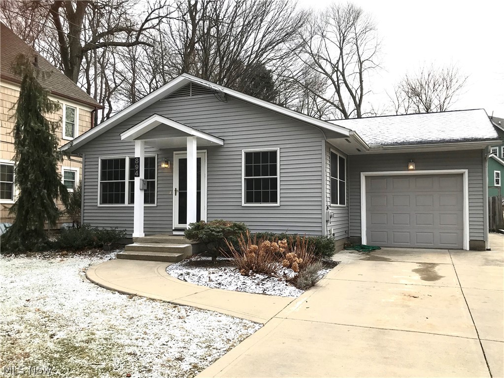 Are you looking in the Kent, Ohio historic district for a manageable property that won't break the bank or the back? Something with incredible curb appeal, very recent roof, newer vinyl siding, windows & exterior lighting, newer electric panel and newer concrete driveway? Then you are looking in the right place! The current owners have done many important upgrades for you! Nestled into what is known to many as one of the most appealing streets in Kent, this 1958 ranch has original hardwood in dining and bedrooms (and also under living room and hall carpet), newer kitchen cabinets with open concept into dining and living rooms, and a one-car attached garage. The back yard boasts a patio, screened porch (new screen panels before closing), patio slab and private fully-fenced backyard. Plus, the entire yard is big enough to enjoy but small enough to match a more carefree lifestyle! With a full unfinished and waterproofed basement (with battery-backup sump pump), expansion of square footage