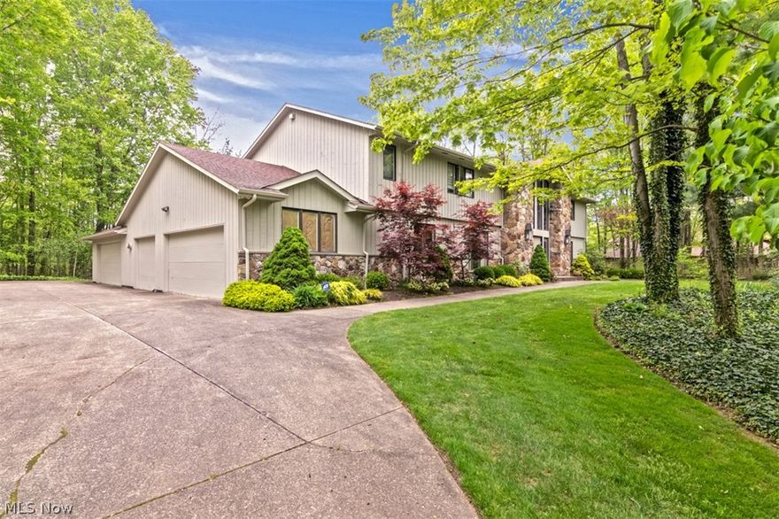 Prepare to be delighted by this artfully renovated colonial in Moreland Hills. With over 4,500 square feet of beautifully appointed living space, an open, inviting floor plan, and an elegant master bedroom suite, it is just waiting for a new owner. Step inside the two-story foyer, where gleaming tile floors flow into the living room on the right and the dining room on the left. The kitchen showcases top-of-the-line stainless appliances, granite countertops, and a sunny eat-in area with deck access. Off of the kitchen, you will find a stunning vaulted family room with a beamed ceiling, fireplace, and a wall of windows that frames the backyard. A laundry room, a full bathroom, and an office with built-ins complete the first floor. Upstairs, there are four bedrooms and two full bathrooms, including the vaulted master bedroom suite with its luxurious private bath. The full lower level is partially finished with a spacious recreation room, an additional living suite, a full bathroom, and a