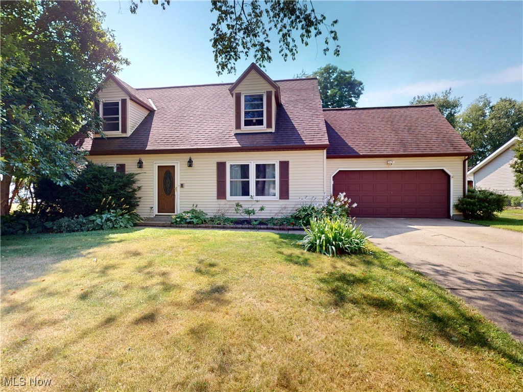 Bursting with charm, this spacious 2,400 sq ft home sits in a beautiful, welcoming neighborhood where every day feels like home. The main floor makes life easy with a roomy primary suite, first-floor laundry, cozy living room, half bath, and an oversized family room addition—perfect for movie nights, game days, or just kicking back. The extra-large kitchen is a standout, featuring custom wood cabinetry, a walk-in pantry, and all appliances included. Upstairs offers three generous bedrooms and a full bath, including a tandem fourth bedroom—great for a home office or creative hideaway. The bathrooms have been tastefully updated, and major systems including the furnace, AC, hot water tank, windows, and refrigerator have all been thoughtfully maintained or replaced. This home has all the style, space, and good vibes you’ve been looking for! City water and sewer!