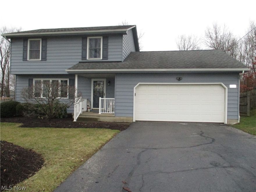 Well Maintained, Move-in Condition, Aluminum-sided, Two Story Colonial. Blacktop driveway. Roofed front porch. Nicely landscaped front yard. Rear yard shed with wood floor and 2 lofts for extra storage. Attached double garage with door opener and side man-door access to side yard. Entry Foyer with guest closet and ceramic tile floor. LR and DR with wood-look laminate flooring. Large picture window in the LR lets in a lot of light. Remodeled Kitchen has oak cabinetry with roll-out drawers, pantry, unique corner cabinet for extra storage, beautiful, built-in corner hutch, ceramic tile floor, all appliances included, and built-in breakfast bar. Spacious, paneled FR with double closet, beamed ceiling and sliding doors out to the rear yard. Half Bath on the first floor. Vinyl replacement windows throughout. Roof approx. 15 years old, one layer. Three spacious Bedrooms on the Second floor and a Full Bath. Hardwood floors in the Bedrooms on the 2nd floor only. Full, open Basement, suitable to