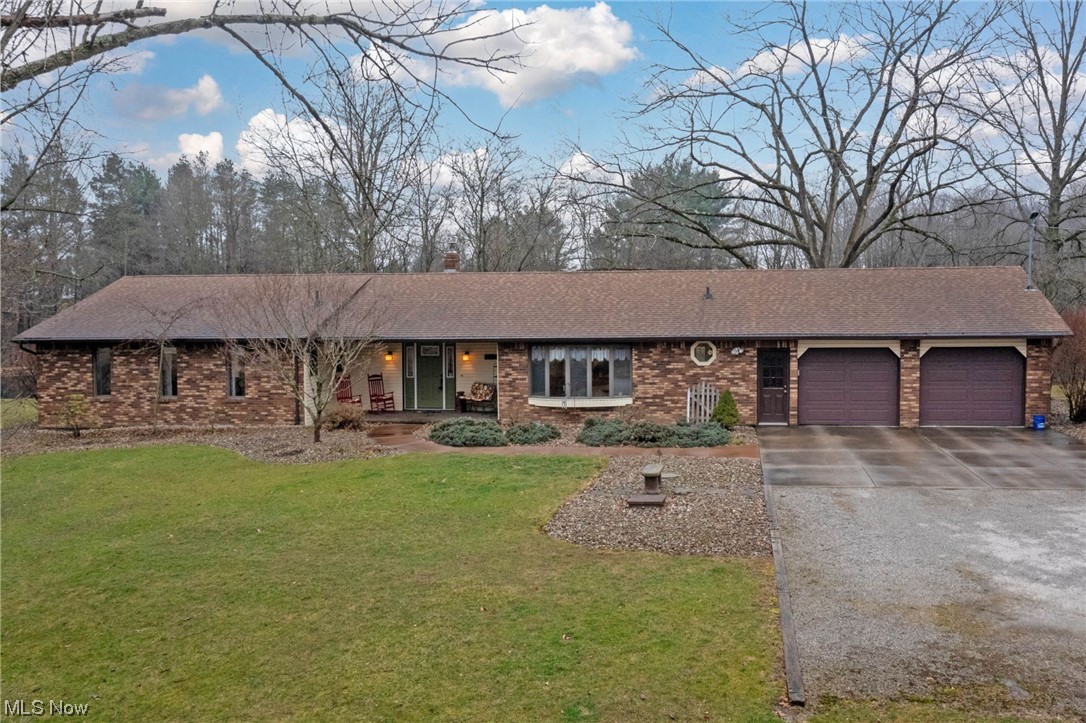 Incredible 3 bedroom, 2.5 brick ranch on a truly park-like setting of 5.3 acres and overlooking a breathtaking pond. Outside will be your oasis with the beautiful pond with aerator and fountain, fire pit area, and target area/back stop. There is also a large outbuilding with concrete floors and electric and a nice shed. Inside you will enjoy a fantastic floor plan with great room that has a stunning stone fireplace, soaring ceilings and incredible views. Main floor laundry. Primary suite with private bathroom. Beautiful kitchen with Corian countertops and island. Formal dining room and eat in kitchen. Serene water views from several rooms! Amazing basement with rec room and multiple office spaces including a separate entry from garage. Many updates including new roof, gutters & downspouts in 2017, back patio new in 2019, furnace and central air new in last 5 years & water heater new in 2024. Convenient location. Ontario School district. Too many updates to list. Don’t miss this one!
