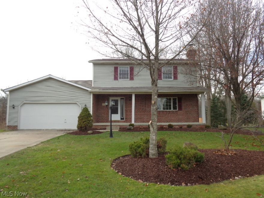 A wonderful front porch greets you as you enter this remodeled Colonial. Boasting 3 bedrooms and 2 & 1/2 baths this home has been remodeled from top to bottom. The foyer has new ceramic tile flooring which is carried through into the kitchen, dinette & laundry area. The living room has a fireplace & large windows. The kitchen is a cooks delight w/ brand new stainless steel appliances including a gas range, microwave, dishwasher, new granite counters, a glass & stainless steel backsplash & crisp white cabinets. The family room features laminate flooring & overlooks the back yard. The 1st floor guest bath has a wonderful vanity with granite countertop & vessel sink. Completing the 1st floor is a huge Laundry/mudroom w/sink & access to the backyard. The 2nd floor features a master suite w/walk-in closet & built-ins & master bath w/shower & vanity w/granite counter. Bedrooms 2 & 3 have access to a hall bathroom w/granite counter. Outside is a huge multi-level deck w/seating area. There is