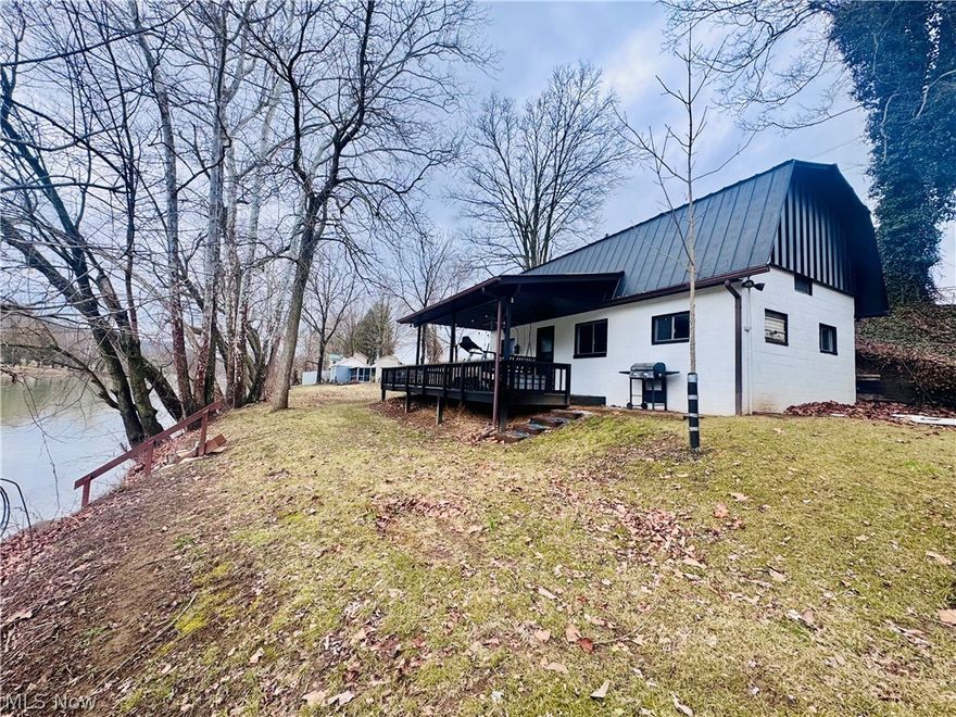 Enjoy peaceful riverfront living with direct frontage on the Muskingum River, complete with your own boat dock for easy water access. Relax on the covered porch overlooking the river, the perfect spot to take in scenic views and unwind year-round.

Inside, the home features an open kitchen and living area with tall ceilings and a cozy fireplace, creating a bright and inviting atmosphere. A pellet stove adds warmth, charm, and energy efficiency. The loft-style layout offers two bedrooms, providing a unique and functional design.

Outside, the scenic yard offers plenty of space to enjoy nature, along with an additional storage building for tools, gear, or recreational equipment. This riverfront retreat blends comfort, character, and outdoor living in a truly special setting.