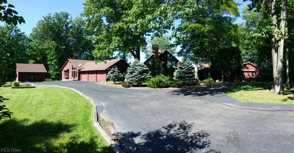 Absolutely Extraordinaire, Custom Sprawling Ranch on Private Enclave a half mile off the main road, 160 Acres to include 40 Acre Private Stocked Lake, unobstructed panoramic views! Incredible use of wood & space. Dramatic Living Room w/Timber-lined Cathedral Ceilings, wall of windows & spectacular 2 Story Fireplace. Healing Labrodorite Kitchen Counters, 2 Pantries, a Stunning Art Studio, greenhouse area, Overly Appointed library retreat w/wet-bar & fireplace. Owner's Suite featuring separate dressing rooms, private shower & sunken garden tub. 2 Guest rooms & Gathering Room at Lake Level w/stone fireplace & patio. Opposite end of the home is a separate In-Law Suite built 06, larger accessible doorway w/separate Family Room & Lake Level Recreation space ready for bar area w/private amenities. 4 Bedrooms, 5 Fireplaces, 4.5 Bath, 5 Car Gar, Enclosed Porch w/an amazing deck w/hot tub. Babbling Brook from an artesian well w/hand laid stone flows into the lake with lots of fun energy