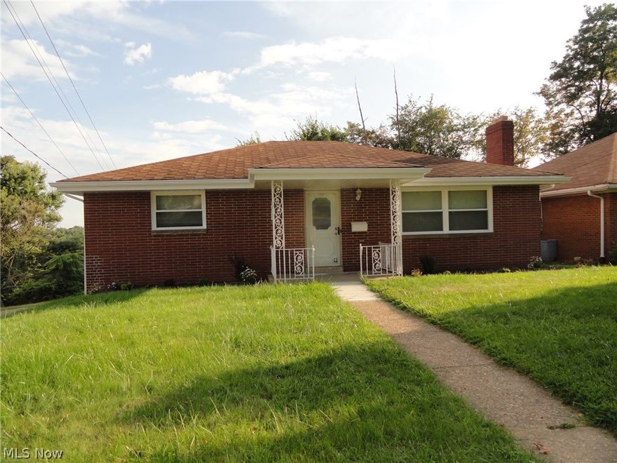 Easy one level brick house features 3 BR, 1 Bath w/large living room w/fireplace, large eat in equipped kitchen, partially finished family room w/fireplace.  New attractive laminate flooring thru-out, new decking, home is move in ready.  Minutes from all amenities.