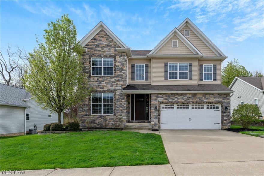 This beautifully updated 4-bedroom, 2 full and 2 half bath home in Mayfield Heights showcases modern finishes and thoughtful upgrades throughout. From the moment you arrive, the professionally designed landscaping with irrigation system sets the tone for what’s inside. Step into a bright, welcoming entryway that flows into a private home office with a large picture window and a formal dining room accented by a tray ceiling. The heart of the home is a stunning, modernized kitchen featuring crisp white cabinetry, granite countertops, stainless steel appliances, a pantry, and a spacious center island—perfect for both everyday living and entertaining. The open-concept family room impresses with a fireplace and a wall of windows that fill the space with natural light. A stylish half bath and functional mudroom area complete the main level. Upstairs, the vaulted primary suite offers a true retreat with a beautiful spa-like bathroom and a generous walk-in closet. Three additional bedrooms, convenient upstairs laundry room and a well-appointed full bath provide ample space for family or guests. The finished lower level adds even more versatility with a recreation area ideal for entertaining, relaxing, or a home gym. Outside, enjoy a thoughtfully designed paver patio with a built-in grill and outdoor refrigerator—perfect for outdoor living. Ideally located near I-271 with easy access to Wilson Mills and Mayfield Road. Minutes from shopping and dining at Heinens and Target. Nestled in a welcoming neighborhood known for its sense of community, this is move in ready home that truly stands out. Schedule your private showing today.